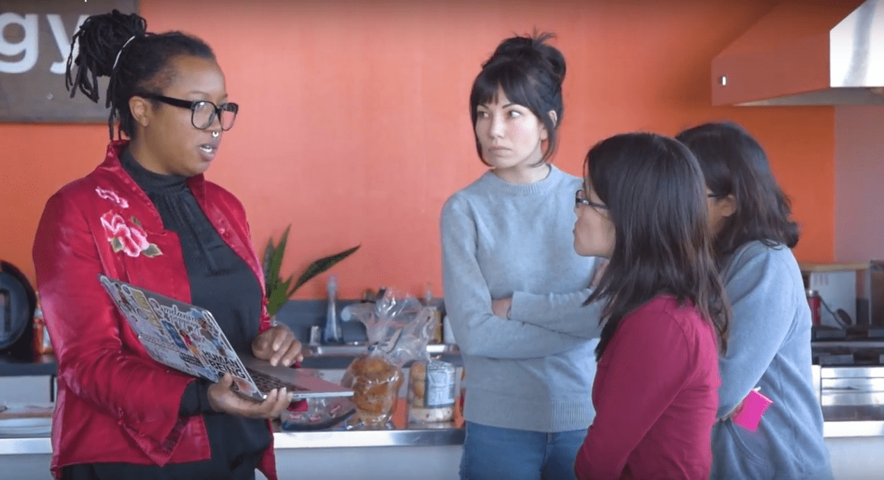 Volunteers listening to woman speaking