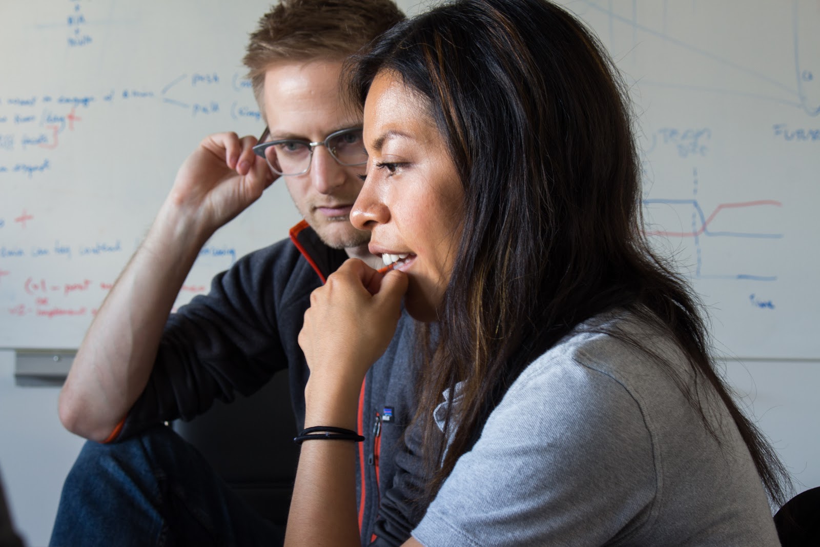 Two people with a Laptop.